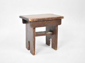A Stained Rustic Milking Stool, 28cms by 20cms and 28cms High