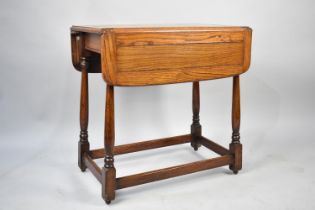 A Mid/Late 20th Century Oak Drop Leaf Trolley, Turned Supports but Missing Castors, 68cms Wide