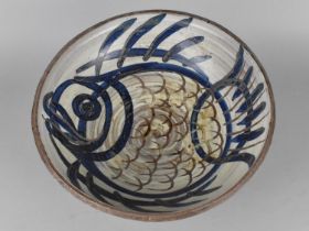 A Studio Pottery Bowl Decorated with Fish Motif, 30cm diameter
