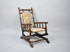 A Childs American Rocking Chair with Tapestry Upholstery