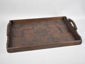 An Art Nouveau Carved Mahogany Two Handled Tray Decorated in Relief, 59cms by 41cms