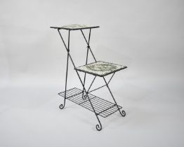 A Wrought Iron and Mosaic Two Tier Off Set Plant Stand with Stretcher Shelf, 57cms Long