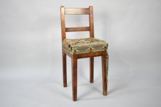 A Rustic Childs High Chair with Ladder Back