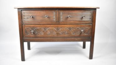 A Mid 20th Century Oak Chest of Two Linenfold Short Drawers and one Long Drawer with Carved Front,