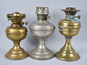 A Collection of Two Brass and a Single Aladdin Oil Lamp Base