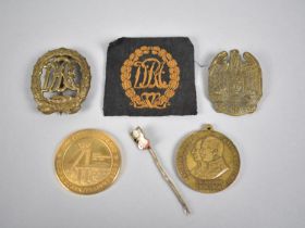 A Collection of Various Replica and Vintage German Badges and Medallions