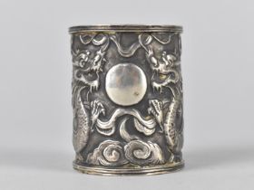 A Chinese Silver Pot of Cylindrical Form Decorated in Relief with Dragons Chasing Flaming Pearl,