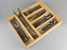A Cutlery Tray Containing Patterned Stainless Steel Cutlery