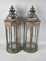 A Pair of Bronzed Metal Cylindrical Octagonal Lanterns, 57cms High