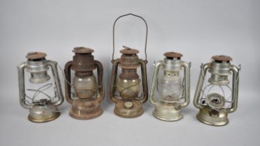 A Collection of Five Vintage Hurricane Lamps