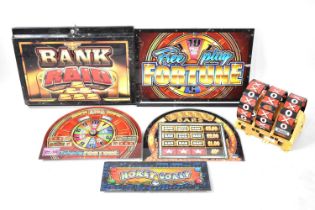 A Collection of Various Printed Perspex One Arm Bandit Panels, together with a Three Section Reel