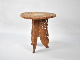 A Far Eastern Carved and Pierced Circular Table on Folding Tripod Stand, 45cms Diameter