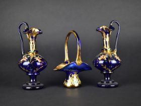 A Pair of Late Victorian/Edwardian Blue Glass Ewers Decorated with Gilt and Coloured Enamels,