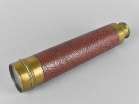 A Brass Leather Covered Three Drawer Telescope inscribed Aitchison and Co, 428 Strand