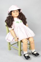 A Large Articulated Modern Doll on Rush Seated Chair, Doll 88cms Tall