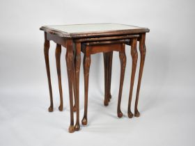 A Late 20th Century Mahogany Framed Nest of Three Tables with Tooled Leather Panel Tops, 54cms Wide