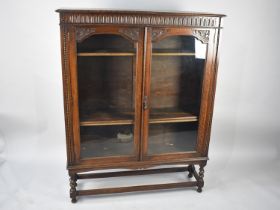 A Mid 20th Century Oak Glazed Bookcase with Short Barley Twist Supports, Carved Decoration, 104cms