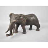 A Large Heavy Patinated Bronze Study of an Elephant, 30cms Long