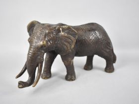 A Large Heavy Patinated Bronze Study of an Elephant, 30cms Long