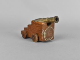 A Small Souvenir Model of a Ship's Cannon With Inset 'HMS Victory' Medallion, 7.5cm long