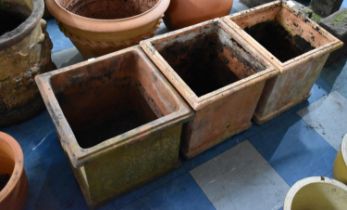 A Pair of Cast Square Planters and a Terracotta Example, 37cm Wide and 36cm high