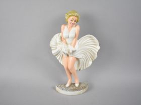 A Reproduction Cold Painted Cast Iron Door Stop in the Form Of Marilyn Monroe, 35cm high