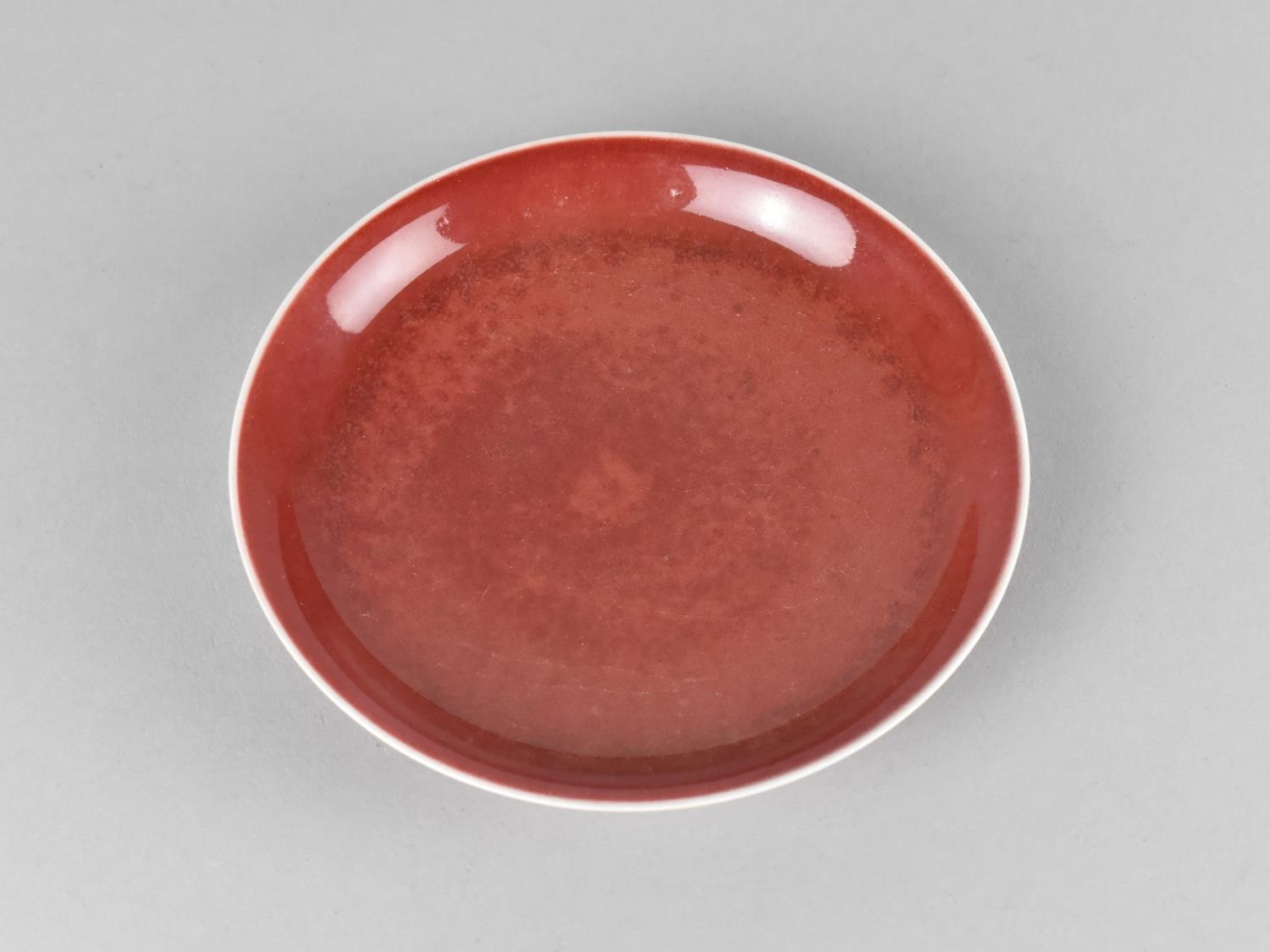 A Small Chinese Monochrome Dish, Sang de Boeuf Glaze, 14.5cm Diameter