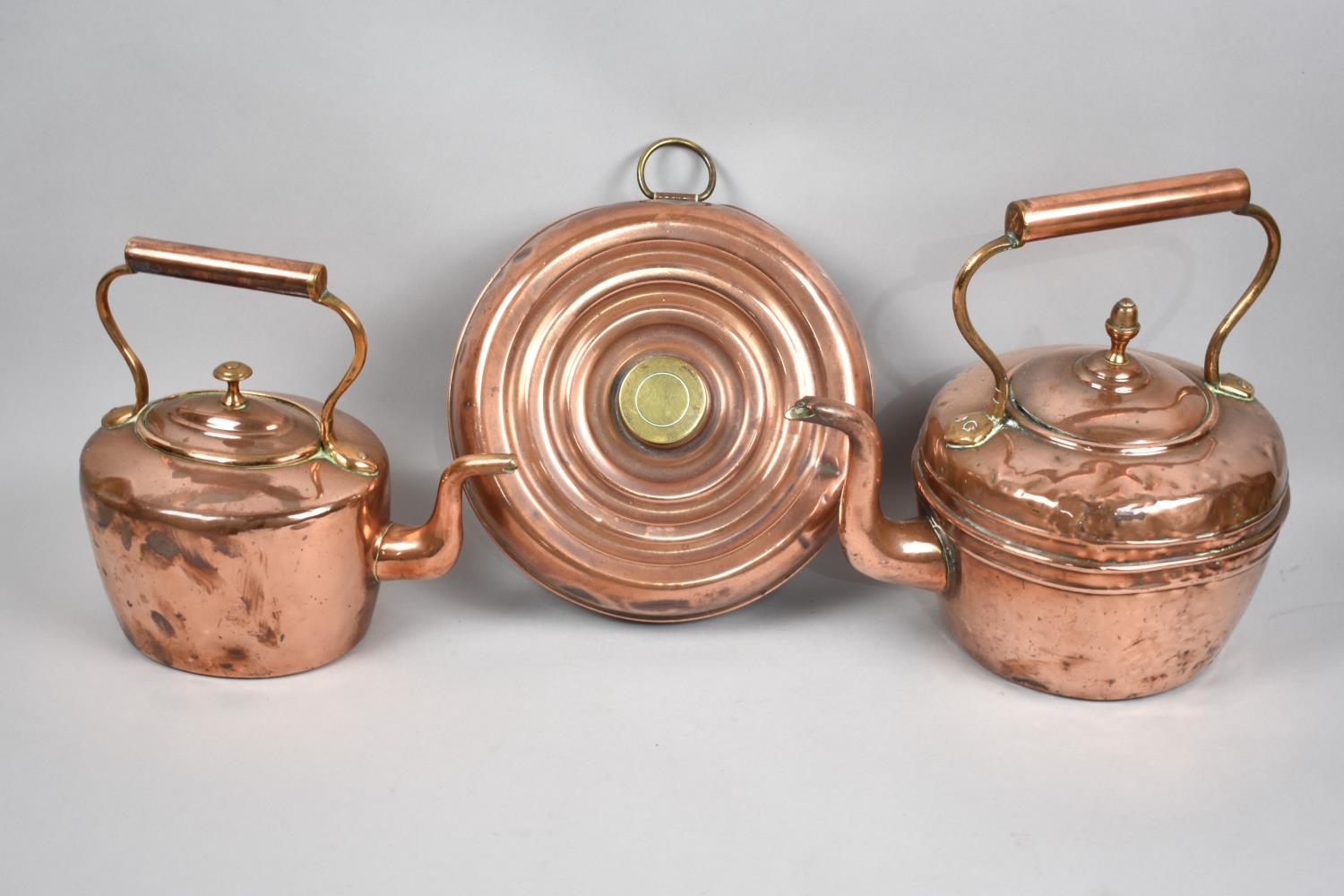 Two Copper Kettles and a Circular Copper Bed Warming Pan