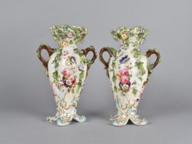 A Pair of Continental Porcelain Encrusted Twin Handled Vases with Pierced Rims, the Bodys with