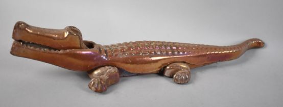 An Enamelled Metal Novelty Nutcracker in the Form of a Crocodile, 36cm Long