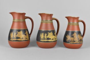 A Graduated Set of Three 19th Century Prattware Terracotta Jugs Decorated with Classical Scene and