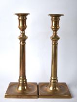 A Pair of 19th Century Bronze Candlesticks, with Pushers, 29.5cm high