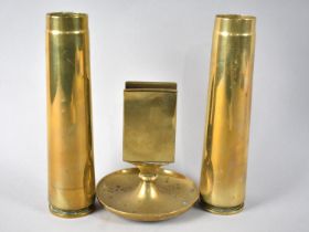 A Brass Matchbox Holder and Pair of Brass Shell Bases, 19cm high