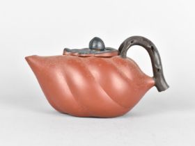 A Chinese Yixing Teapot Modelled as a Gourd with Leaf Finial and Stylised Branch Handle, Makers Mark