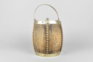 A Mid 20th Century Oak and Silver Plate Biscuit Barrel, 16cm high