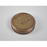 A Circular Reproduction Brass Compass, the Screw off Lid with One Hundred Year Calendar, from 1957-