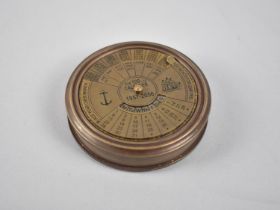 A Circular Reproduction Brass Compass, the Screw off Lid with One Hundred Year Calendar, from 1957-