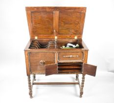 An Edwardian Oak Cased Angelus Astrola Windup Gramophone Cabinet on Barley Twist Supports and with