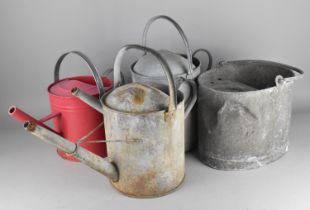 Three Various Watering Cans Together with a Mop Bucket