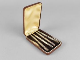 A Cased Set of Four Sterling Silver Propelling Pencils