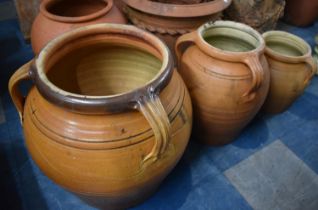 A Set of Three Graduated Circular Three Handled Patio Planters, the Largest, 46cm High