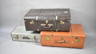 Two Vintage Travelling Trunks and a Smaller Suitcase