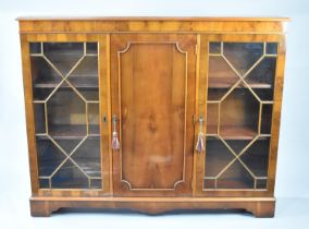 A Late 20th Century Astrological Glaze Triple Bookcase in Yew with Panelled Centre Door, Flanked