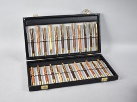 A Case Collection of Twenty-Four Wooden Barrelled Ballpoint Pens, all but Three with Clips in the