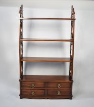 A Reproduction Mahogany Wall Hanging Shelf Unit with Four Short Drawers to Base and Three Shelves