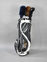 A Modern Cleverland Gold Ultra Light Bag Containing Three Ping Woods and a Golf Craft Six Iron