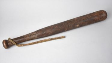 An Edwardian Turned Wooden Truncheon with Ribbed Handle and Leather Strap, 45cm Long