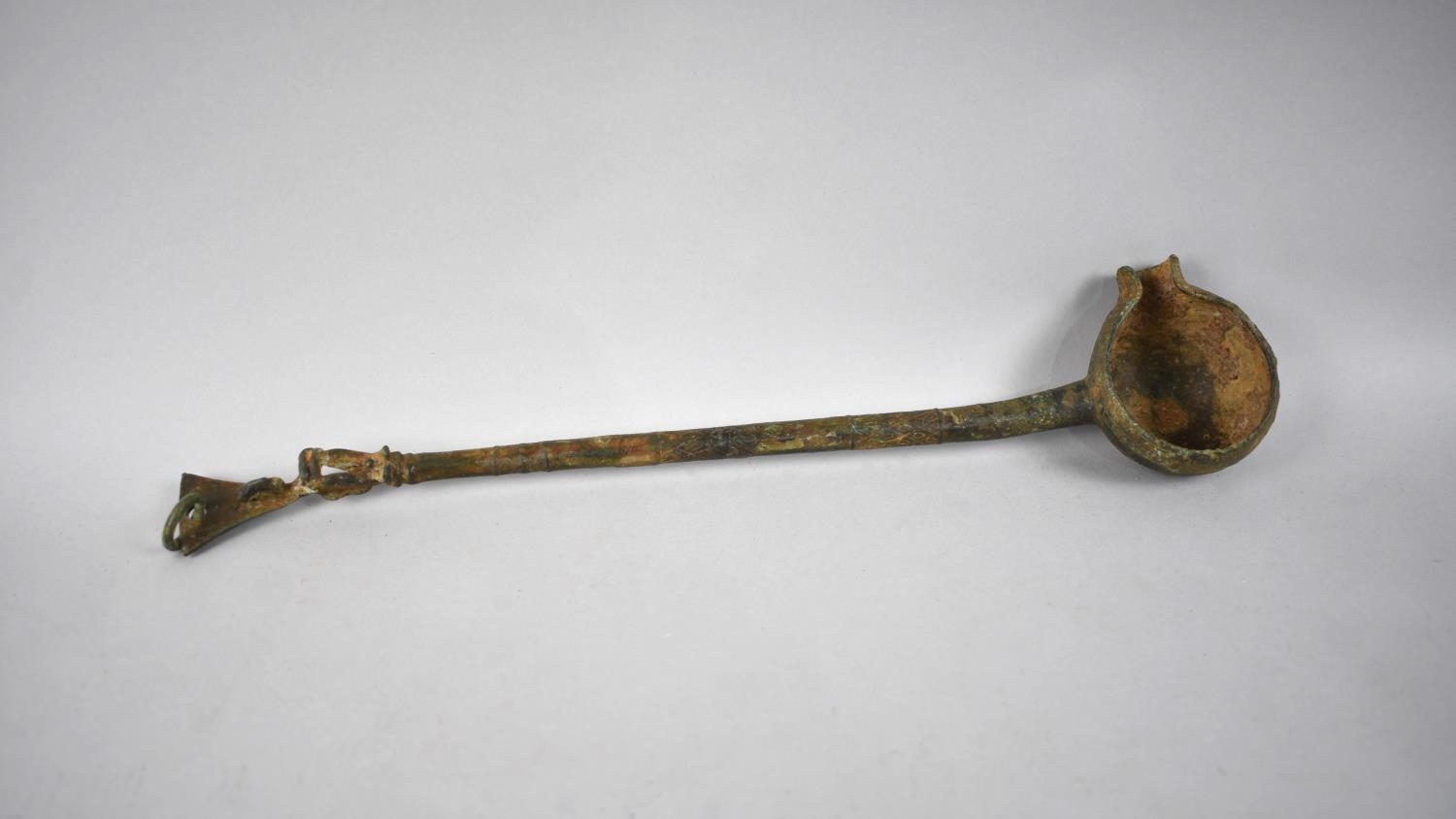 An African Benin Bronze Ladle, Handle Decorated with Seated Figure, 38cm Long