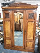 A Late Victorian Burr Walnut and Mahogany Triple Wardrobe, Central Mirror Door to Hanging Section