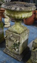 A Reconstituted Stone Garden Urn of Classical Form Set of Square Plinth Base with Shield Motif in